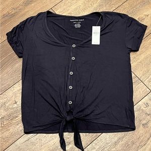 American Eagle Navy Top with tie at bottom .  Size XS.  NWT